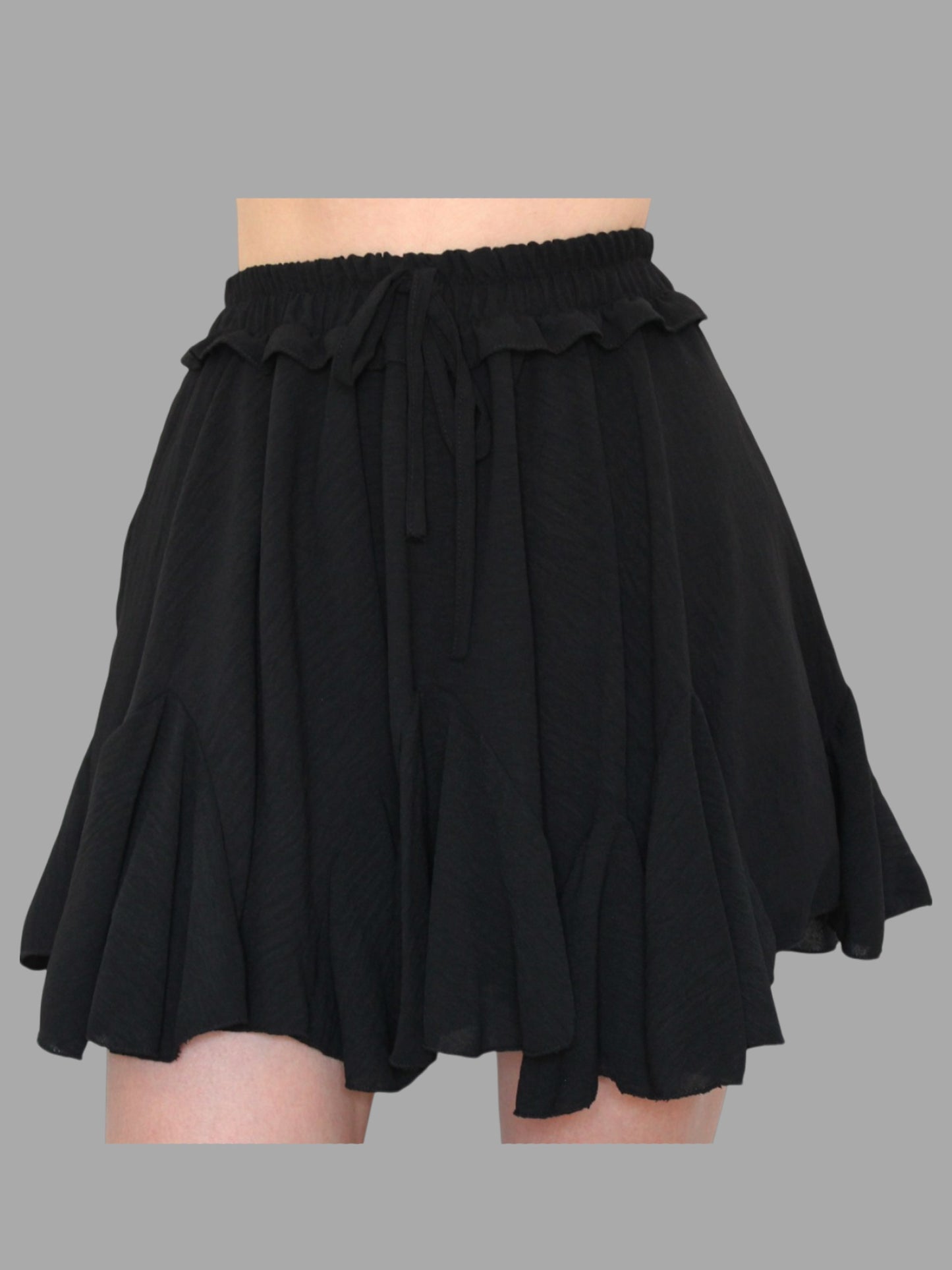 Gonna-pantaloncino con balze